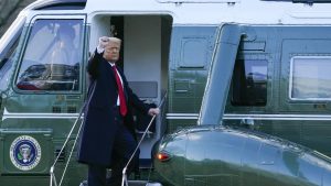 President Donald Trump gestures as he boards Marine One on the South Lawn of the White House, Wednesday, Jan. 20, 2021, in Washington. Trump is en route to his Mar-a-Lago Florida Resort. (AP Photo/Alex Brandon)