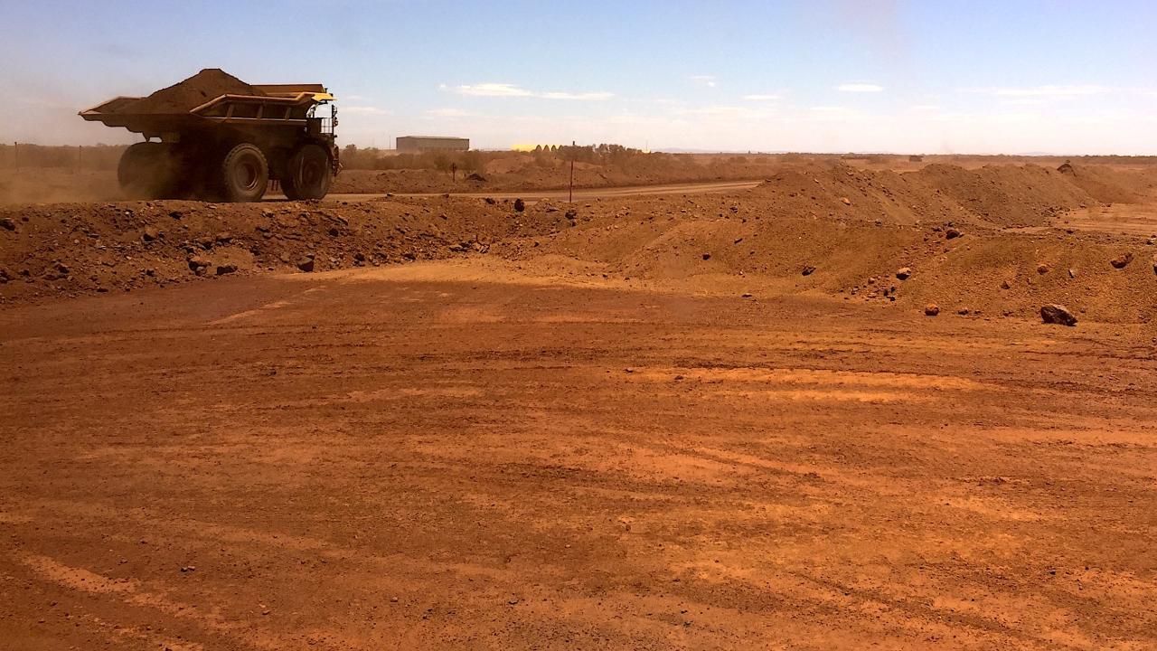 An autonomous vehicle drives along a road as it collects iron ore at Australia's Fortescue Metals Group (FMG) mine in the Pilbara region, located south-east of the coastal town of Port Hedland in Western Australia, November 29, 2018. Picture taken November 29, 2018. REUTERS/Melanie Burton (Australia)