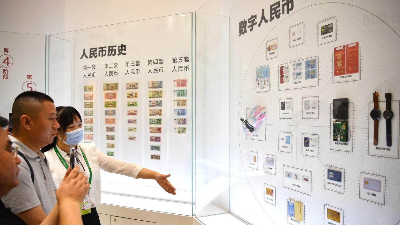 Visitors learn about digital Chinese yuan (e-CNY) at the first China International Consumer Products Expo in Haikou, capital of south China's Hainan Province, May 8, 2021. Several banks have offered experience zones for payment with e-CNY at the Expo. (Xinhua/Guo Cheng)