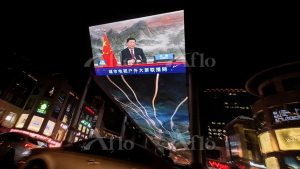 A screen displays a CCTV state media news broadcast showing Chinese President Xi Jinping addressing world leaders at the G20 meeting in Rome via video link at a shopping mall in Beijing, China, October 31, 2021. REUTERS/Thomas Peter (China)