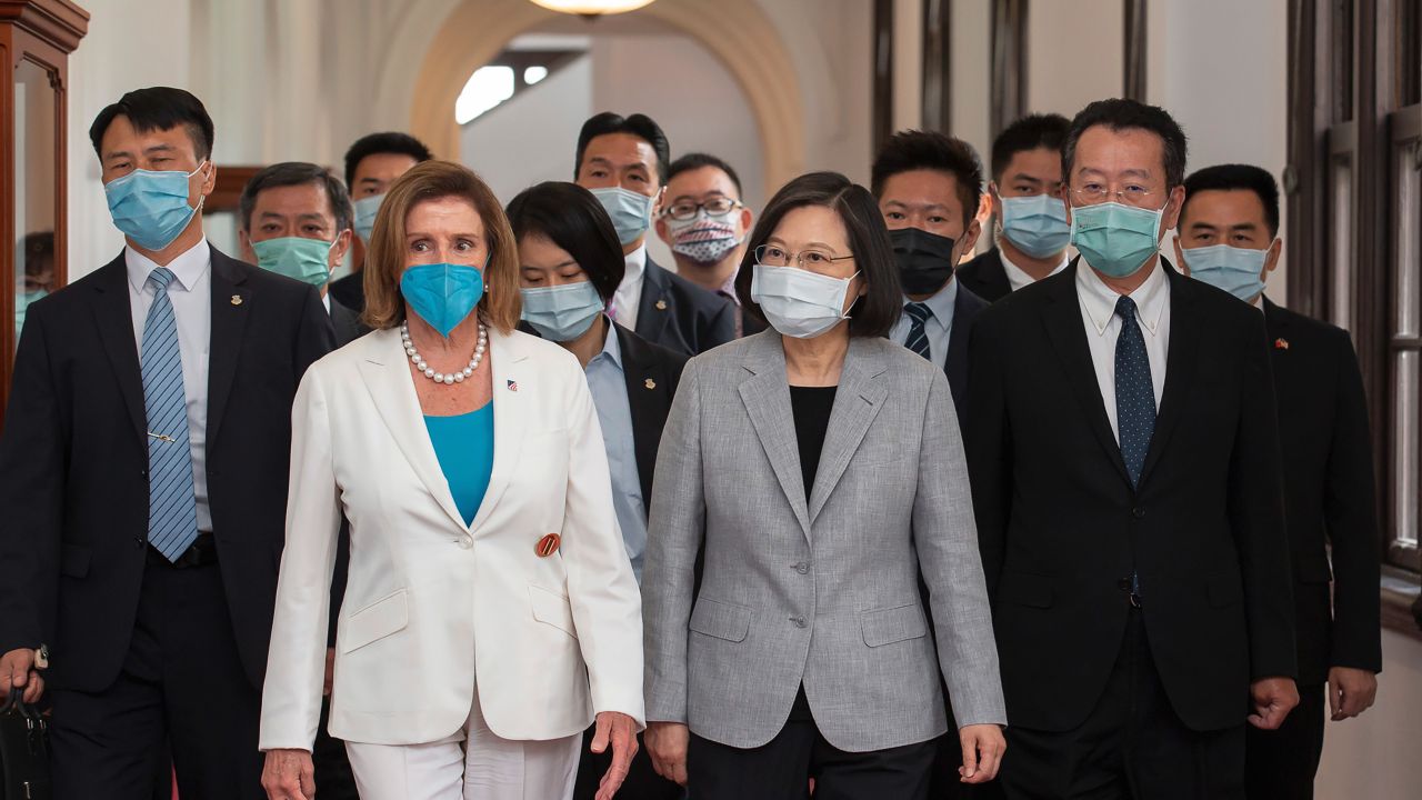 In this photo released by the Taiwan Presidential Office, U.S. House Speaker Nancy Pelosi, left, and Taiwanese President President Tsai Ing-wen arrive for a meeting in Taipei, Taiwan, Wednesday, Aug. 3, 2022. U.S. House Speaker Nancy Pelosi, meeting top officials in Taiwan despite warnings from China, said Wednesday that she and other congressional leaders in a visiting delegation are showing they will not abandon their commitment to the self-governing island. (Taiwan Presidential Office via AP)